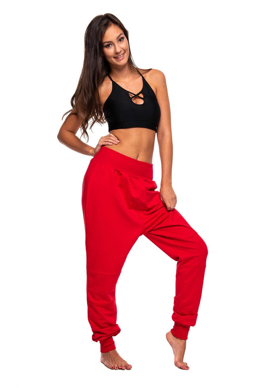 Red drop-crotch tracksuit pants for women, men, and kids.